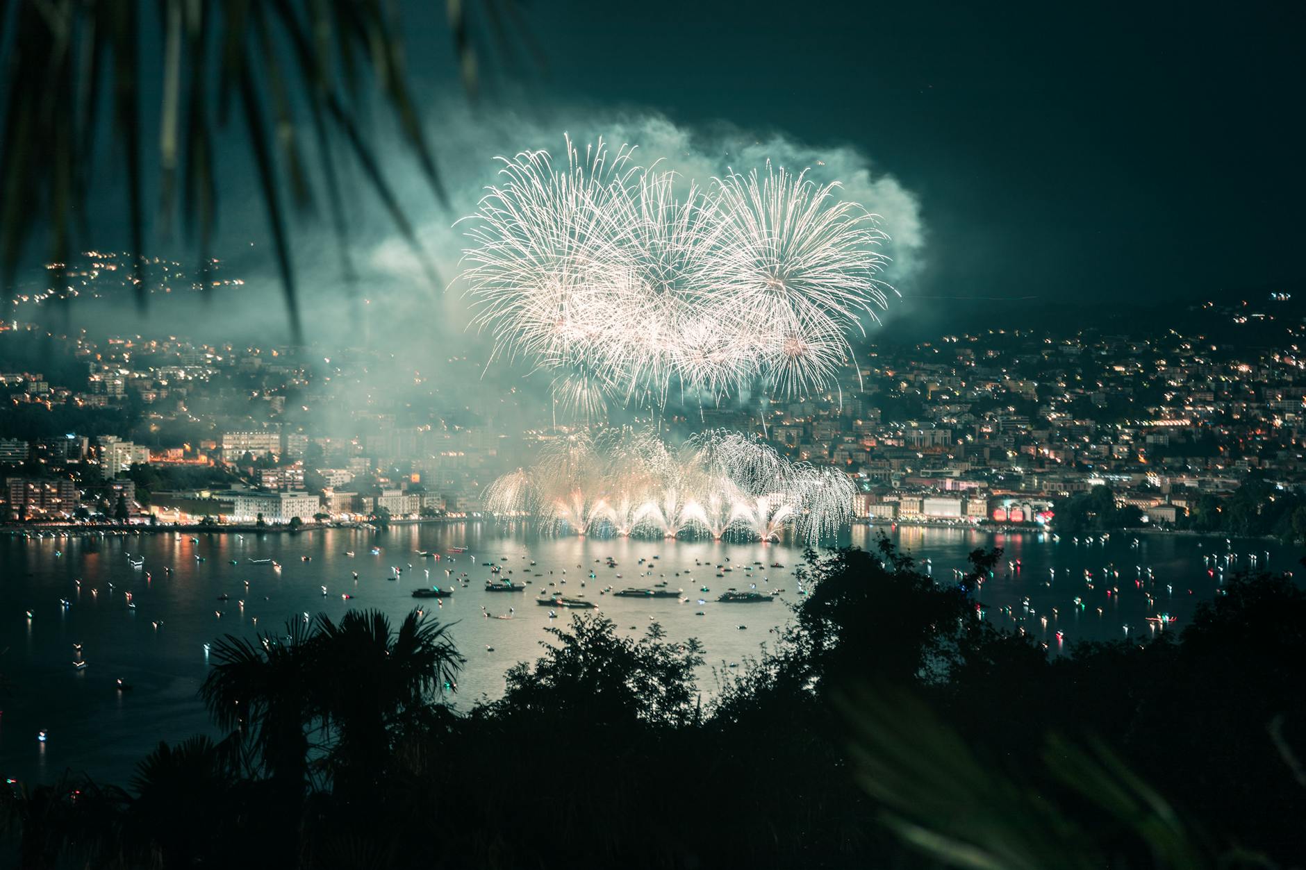 fireworks display over body of water during night time